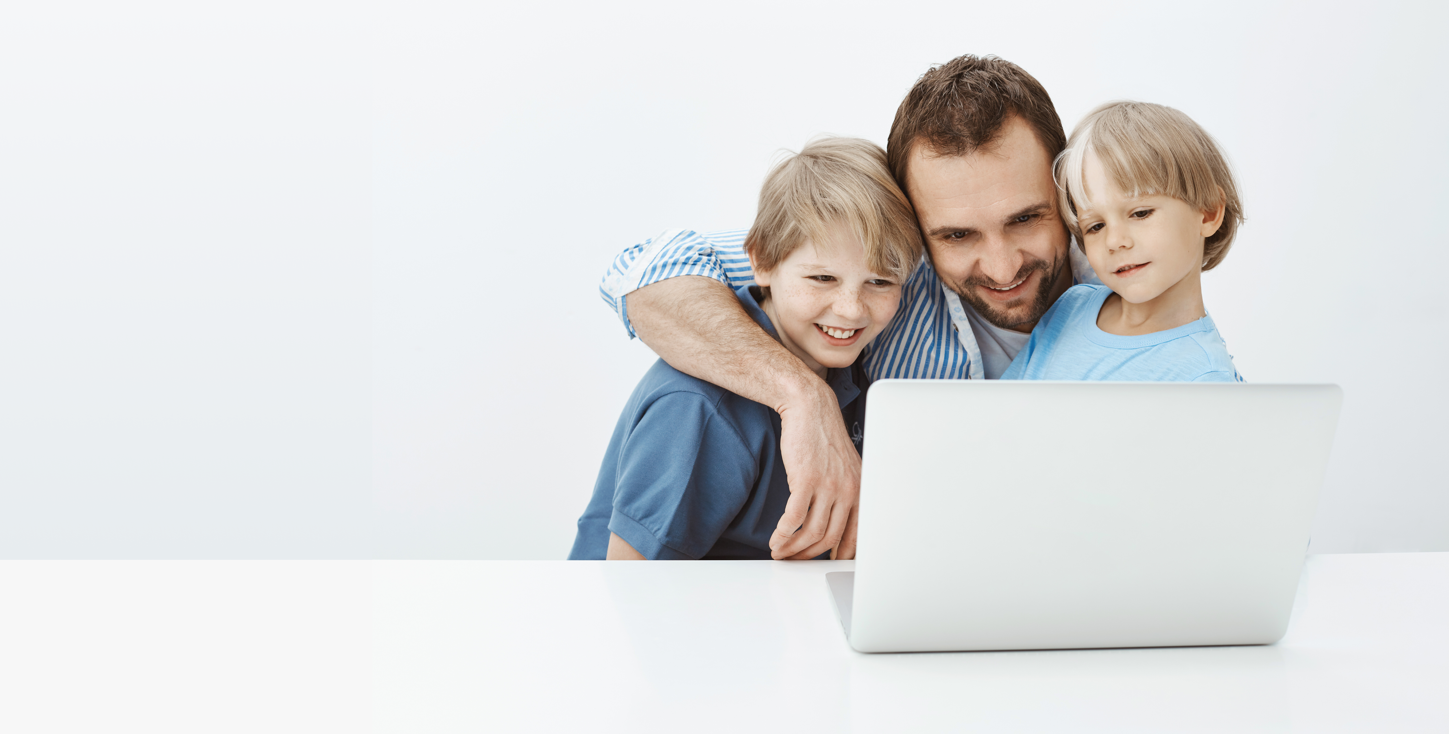 Family looking at laptop